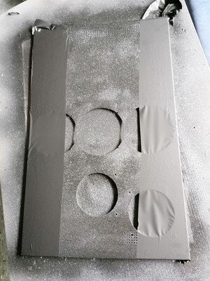 First coat: primer, second coat: matte black, thirdly added sparkly sprinkles. In the picture I started taping the sides for what comes next.