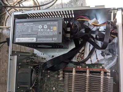 I made my own modular cables with old molex connectors for the HDD backplane. The unused cables in the plastic bag has its place at the back of the PSU.